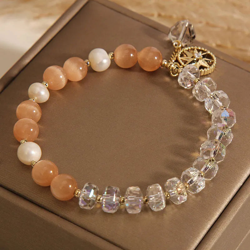Orange Eight Awn Star bracelet with gold-plated setting and opal crystal inlay