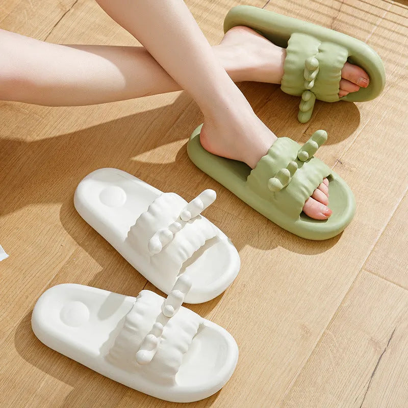 Women's hollow-out flip-flop slippers in light yellow with a textured non-slip EVA sole.