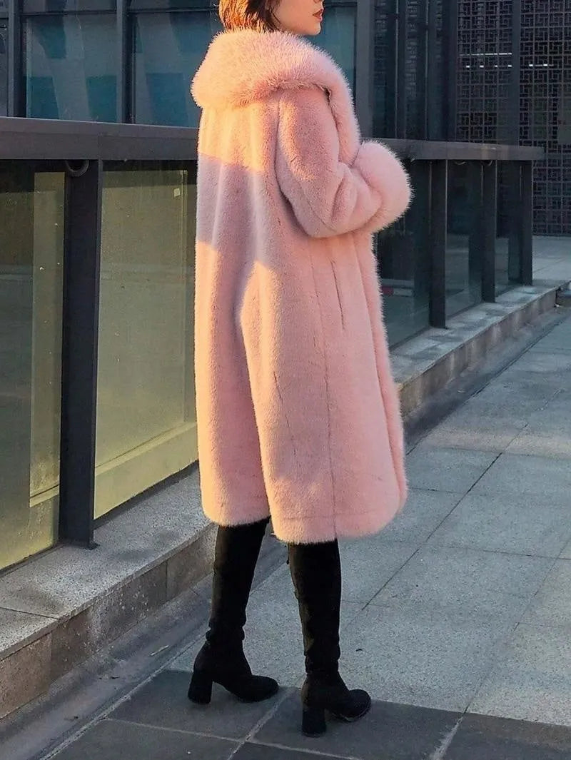 Women's grey thick faux fur mid-length coat with a matching fur collar.