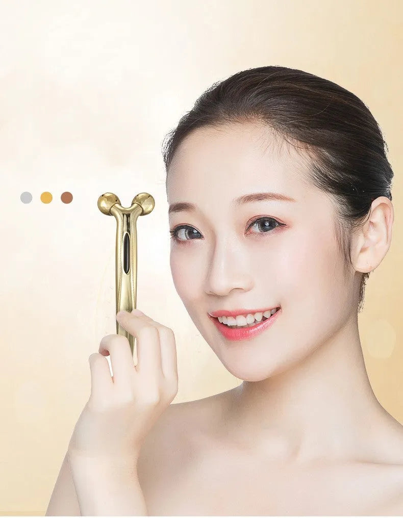 3D face-lifting manual roller massager with positive ion function in silver UV-plated finish