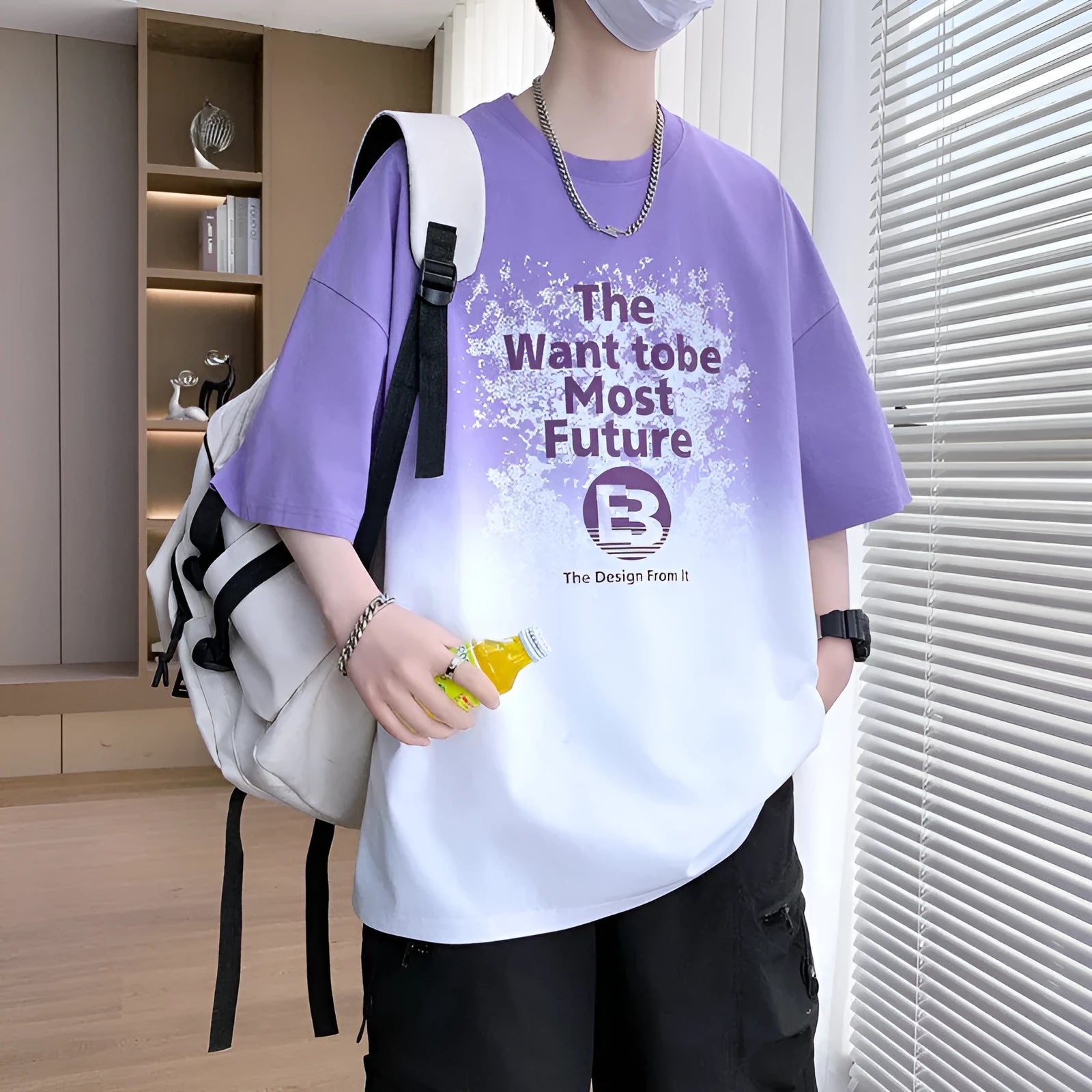 Boy wearing a dark blue youth T-shirt with a printed text pattern and drop-shoulder sleeves