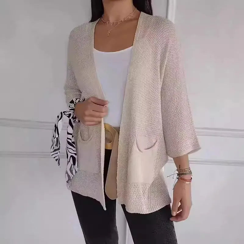 Women's waffle texture cardigan coat with nine-quarter sleeves shown in army green colour.