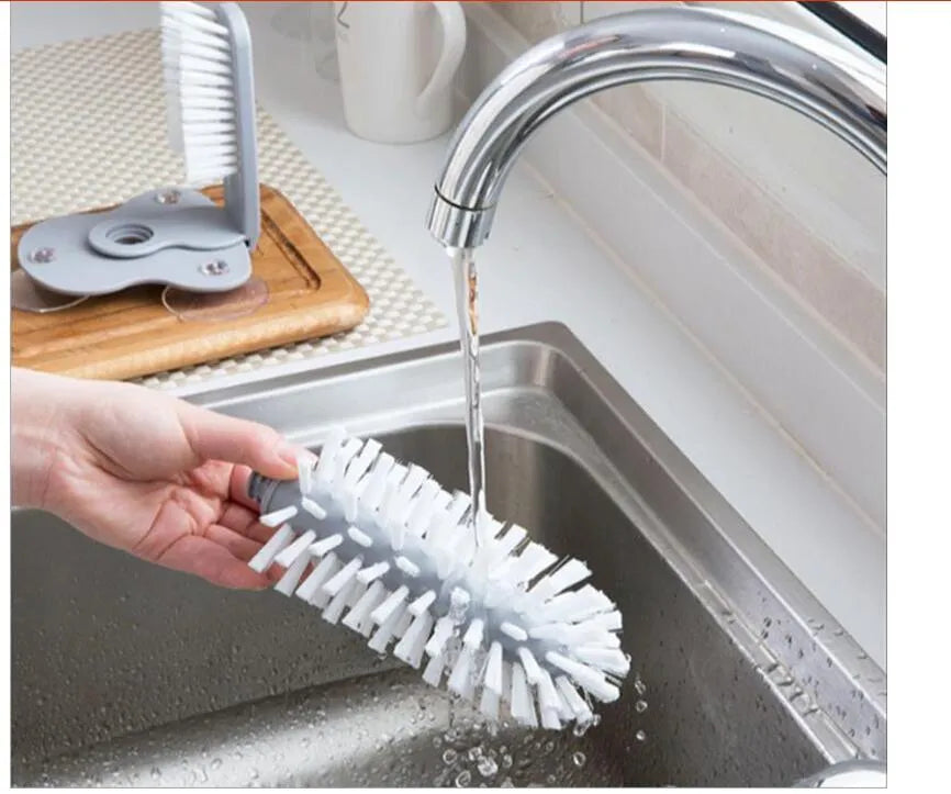 Grey double-head rotating cup brush with suction cups for wall mounting
