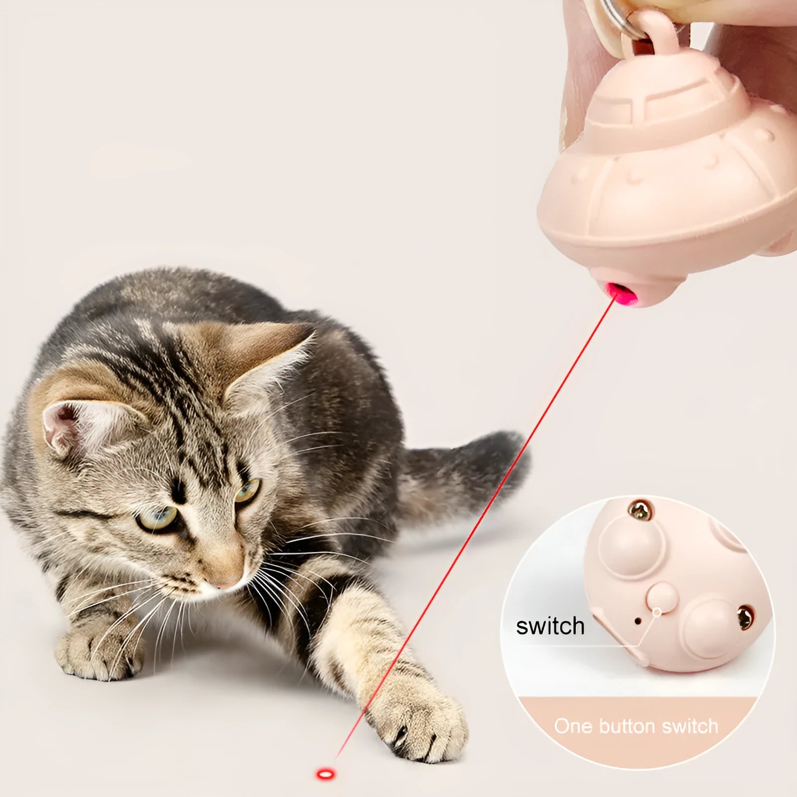 Green automatic cat laser toy attached to collar with USB charging port visible