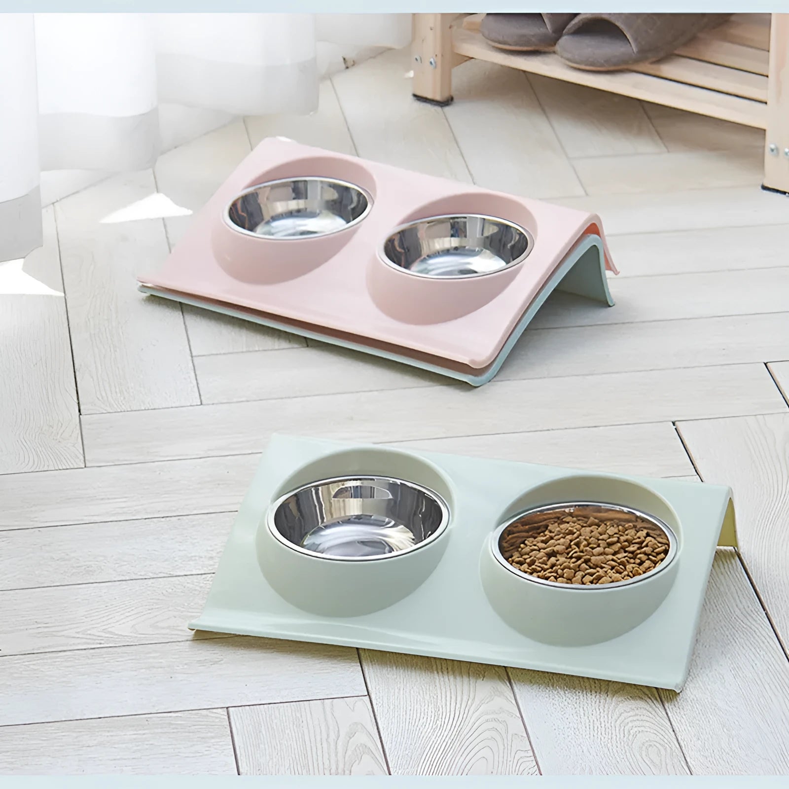Stainless steel pet double bowl with green PP base and metal inner bowl on floor