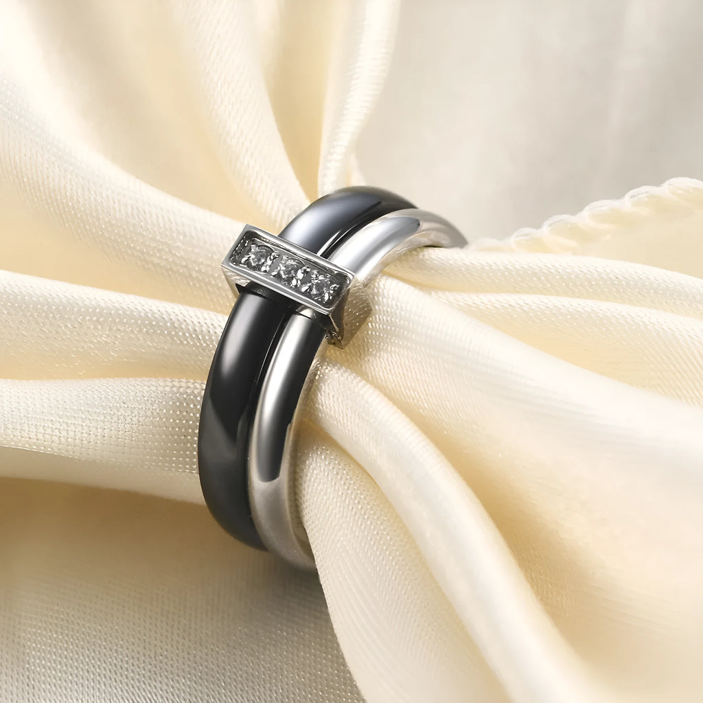Glossy black ceramic women's ring with round inlaid detail on a 6mm wide geometric band.