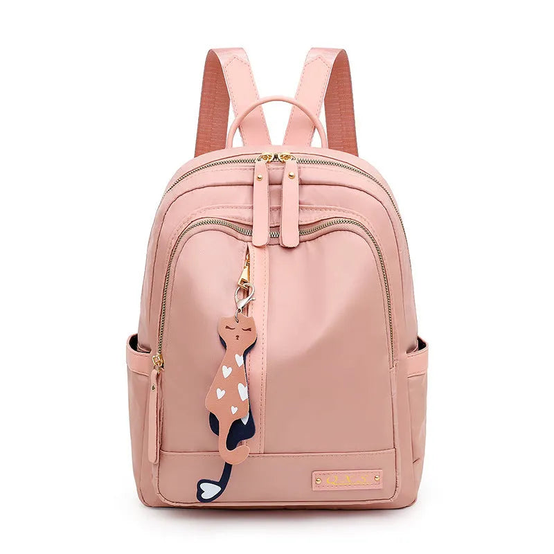 Women's black nylon backpack with anti-theft pockets and water-resistant finish.