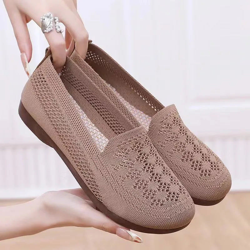 Women's beige low-top casual slip-on shoes with mesh upper and round toe.