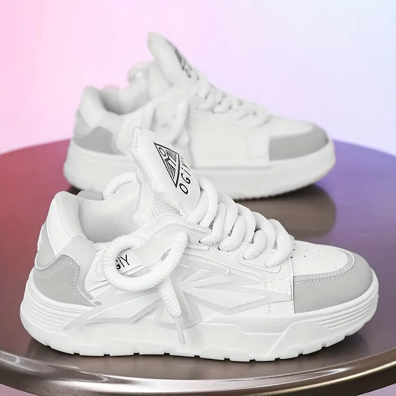 Men's white chunky sneakers with cartoon pattern, thick rubber sole, and front lace-up design on a plain background.
