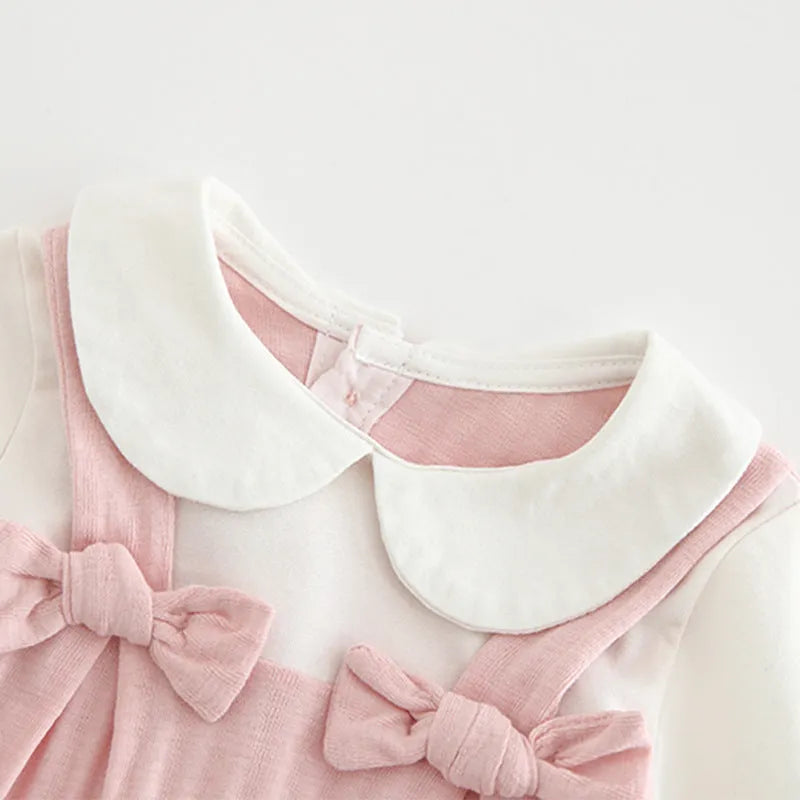 Pink cotton baby girls romper suit with embroidery, long sleeves, and single-breasted closure