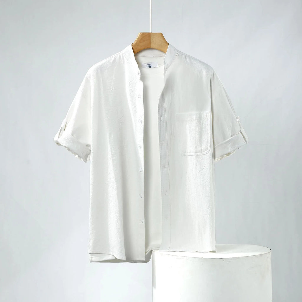 Men's loose-fit short-sleeve linen shirt in a solid colour with a stand collar.