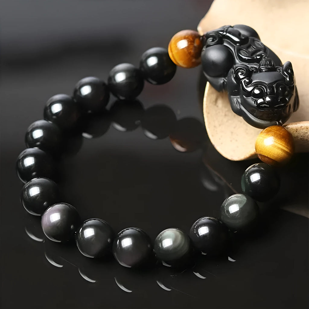 Black obsidian crystal Pi Xiu bracelet with ethnic styling and spiritual symbolism