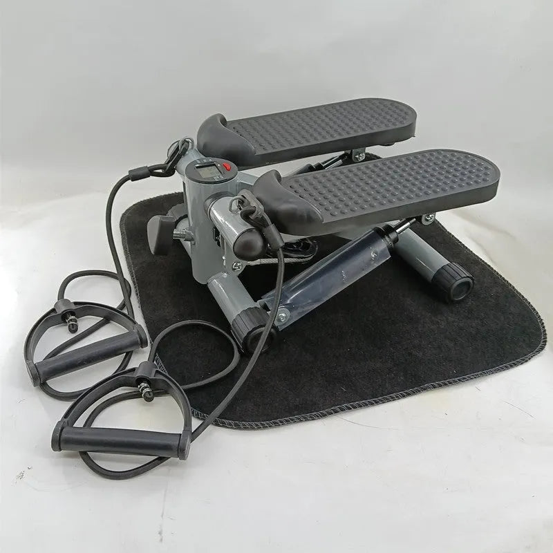 Silver grey hydraulic resistance exercise stepper machine for home fitness.
