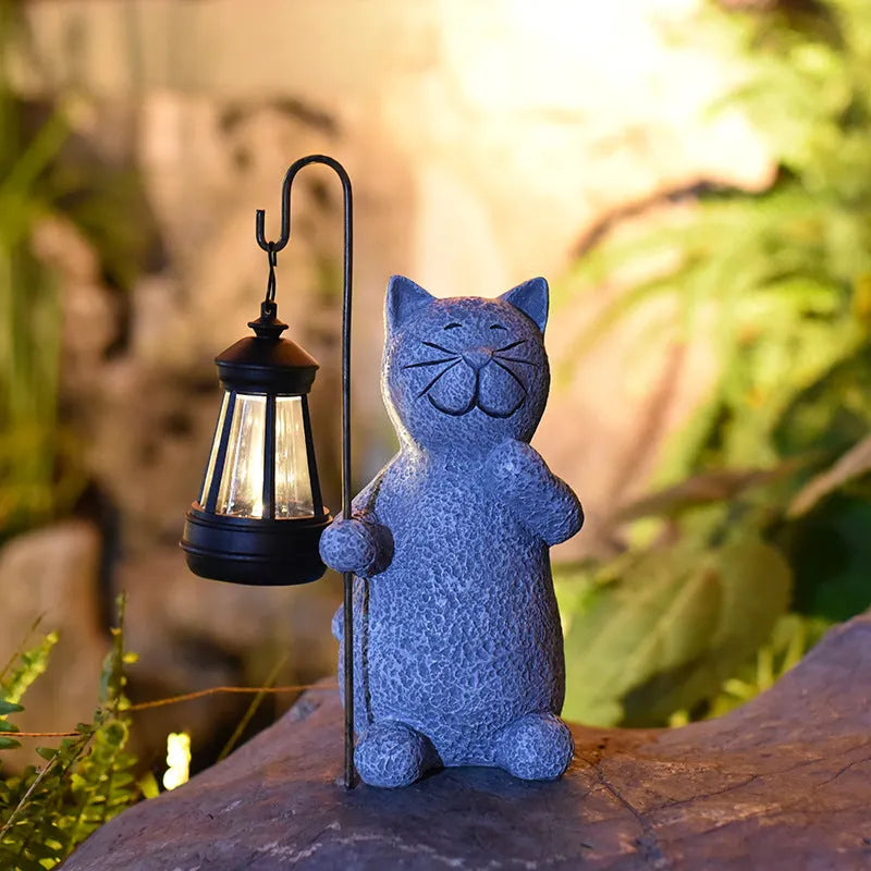Solar-powered garden lamp with resin kitten ornament decoration for outdoor lighting