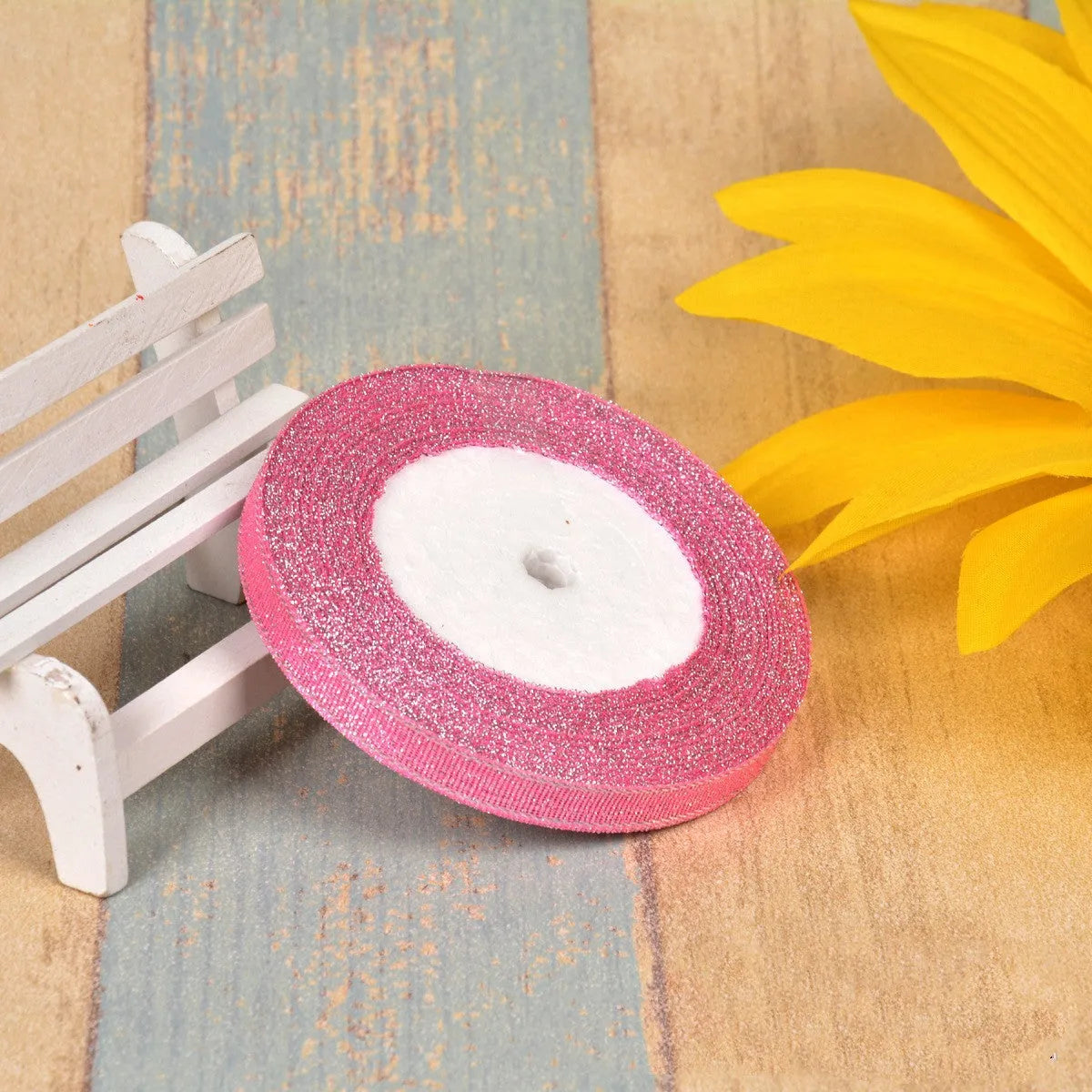 Colourful green onion pattern polyester ribbon spool with metallic gold or silver wire detailing.