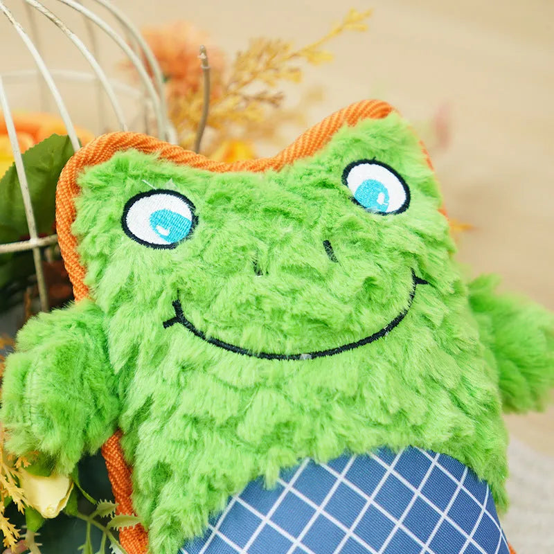 Blue, green, and pink dog toys with sound features and bite-resistant construction safe for molar teeth.