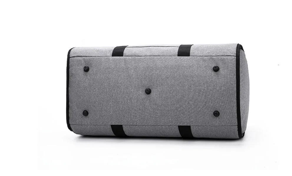 Medium-sized cylindrical travel bag in black Oxford cloth with a zipper and carrying handles.