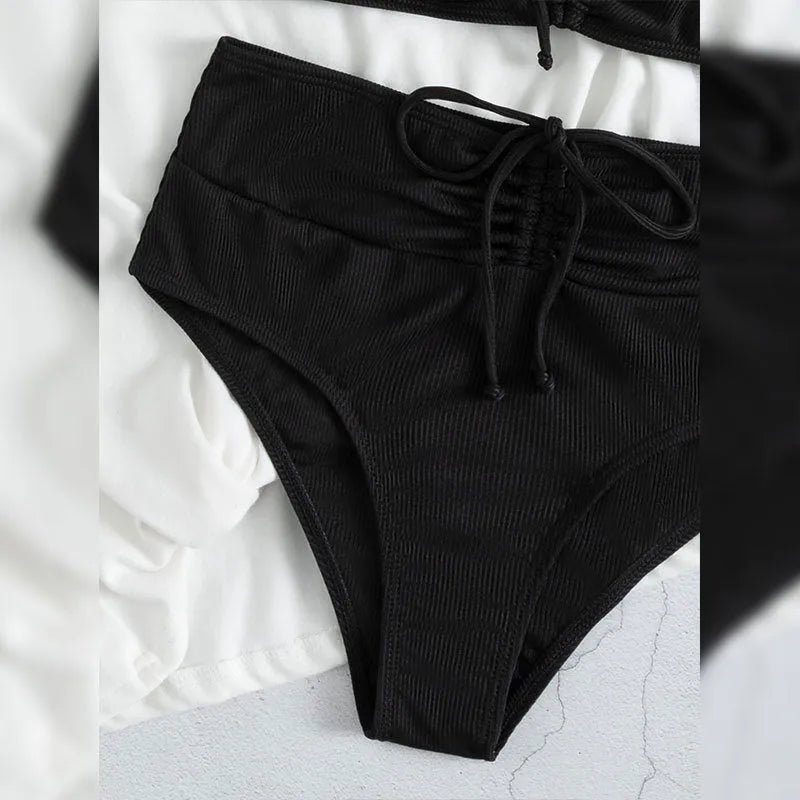 Black women's high waist sling split bikini swimsuit with sleeveless top and shorts