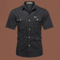Men's loose beige cotton short sleeve cardigan-style work shirt on a hanger.
