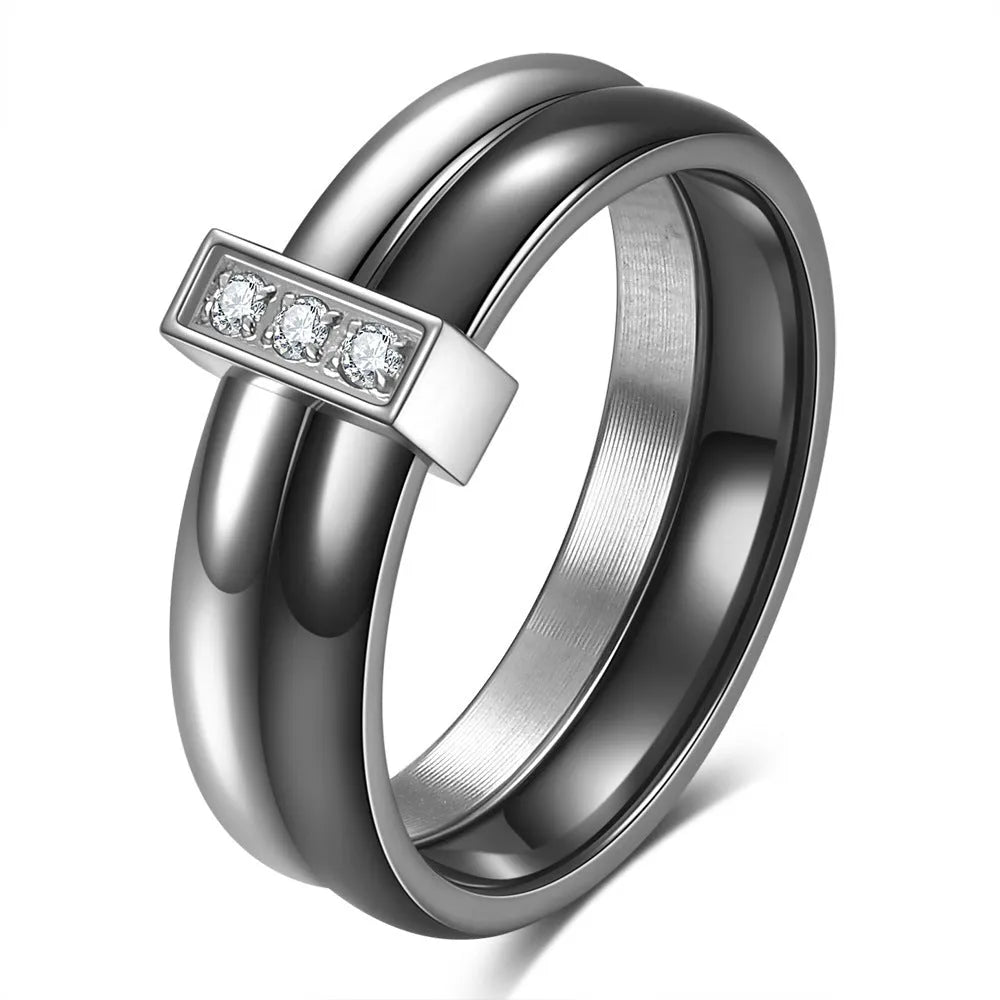 Glossy black ceramic women's ring with round inlaid detail on a 6mm wide geometric band.