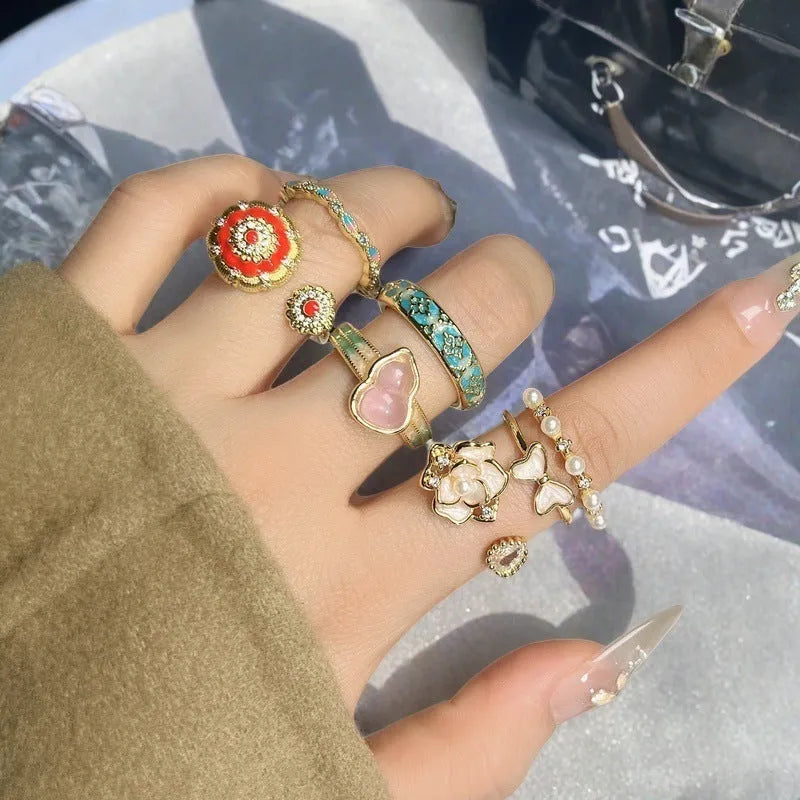 Copper adjustable vintage gourd ring with floral bow design and inlaid zircon stones.