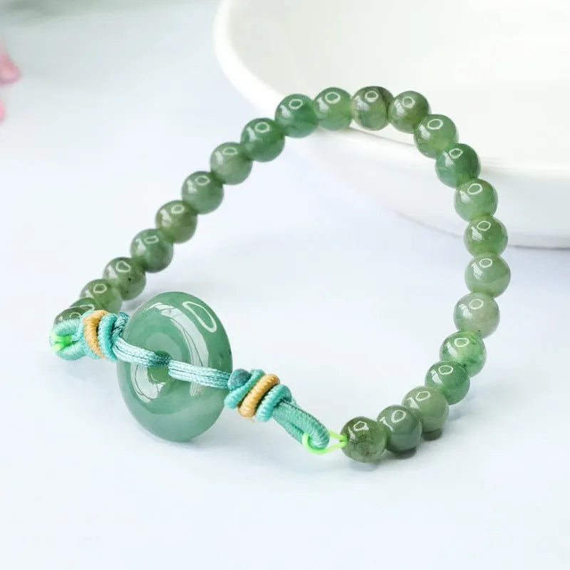 Oil green jade bracelet with safety buckle closure showing star-shaped 6mm beads