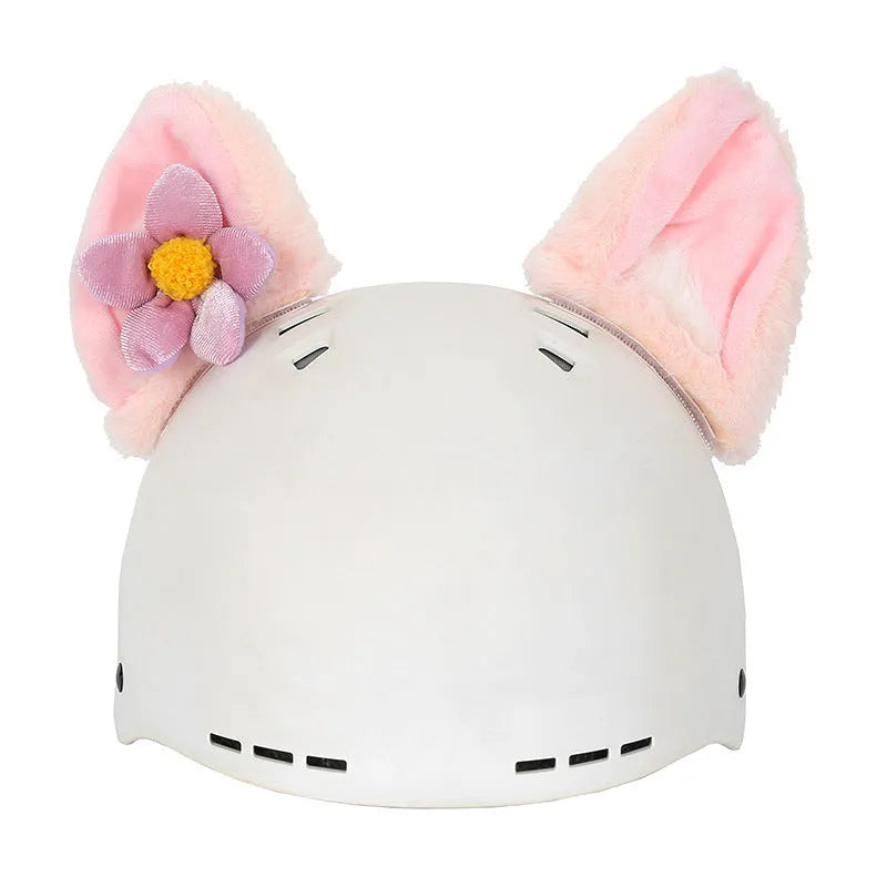 Child wearing a soft plush cartoon animal helmet hat cover with large character face and attached ears.