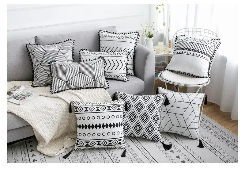 Bohemian national style polyester cushion cover in light grey on a sofa.