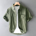Men's loose fit pure cotton short sleeve casual shirt in apricot colour on a hanger.