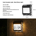 Solar powered waterproof doorplate light with LED illumination in black or silver finish
