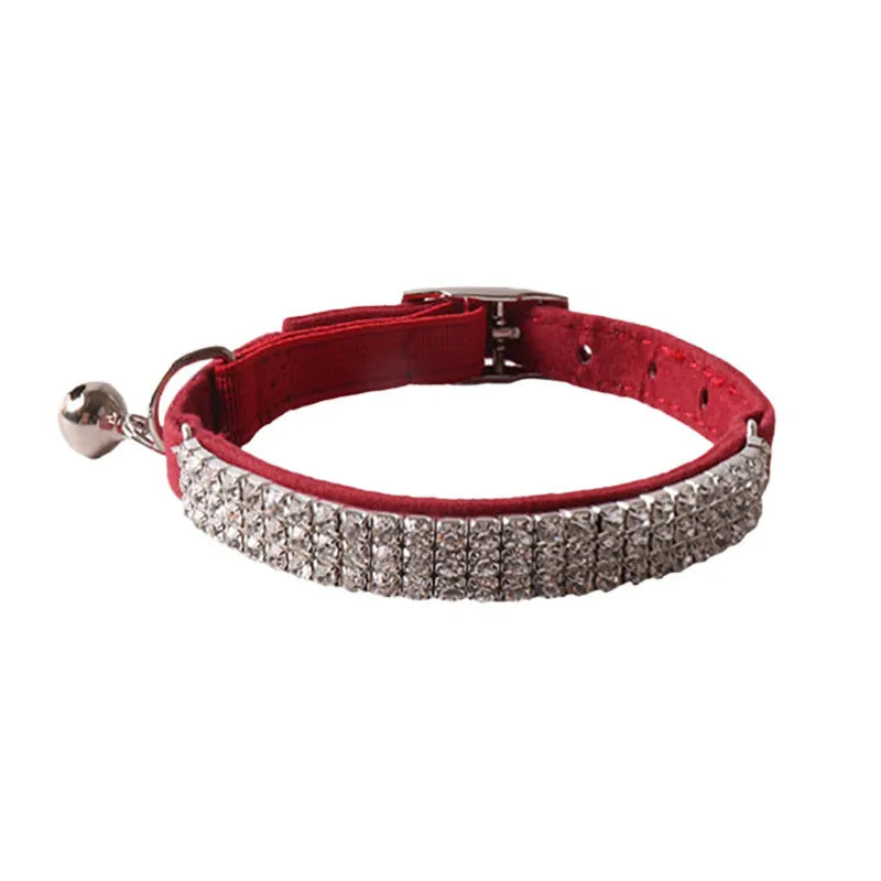 Elastic buckle cat collar in flocking fabric with gang drill detail, shown in multiple colours.