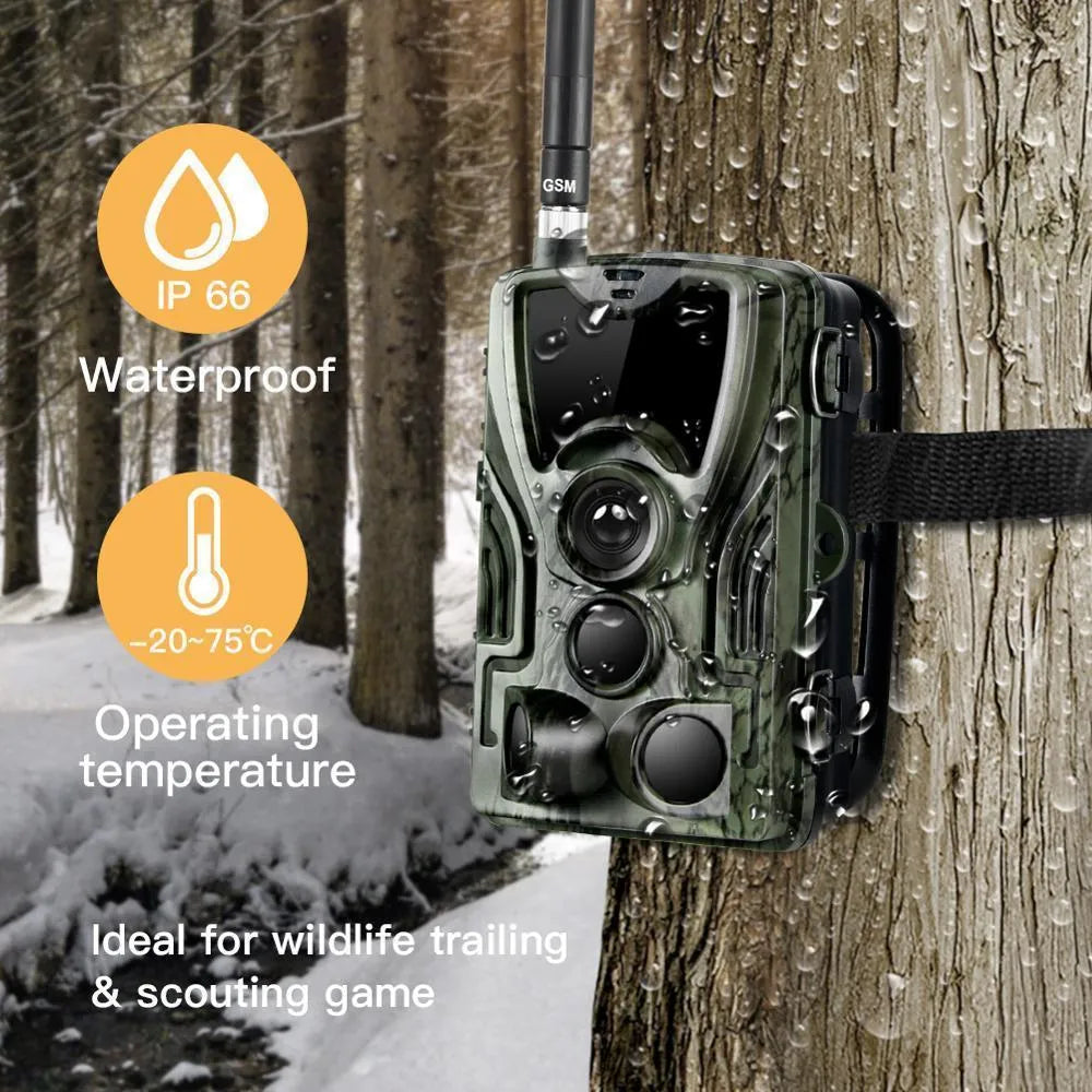 Green cellular trail camera with belt mount showing display screen and infrared LEDs
