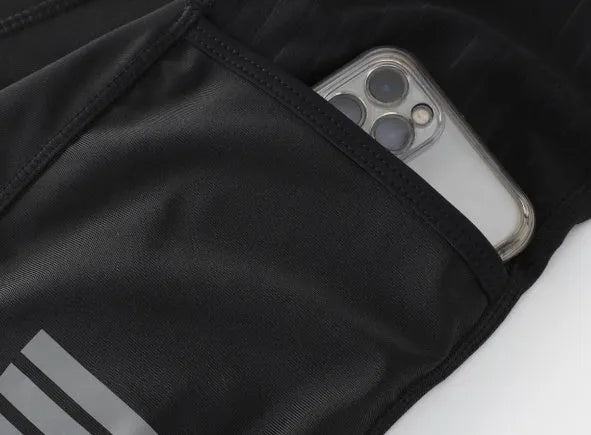 Black seven-inch cycling shorts with a shock-absorbing cushion, compression fit, and side pockets.
