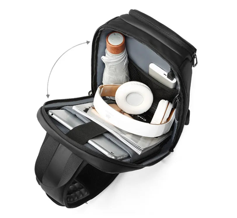 Black medium outdoor PVC shoulder bag with an air cushion strap and organiser pockets.