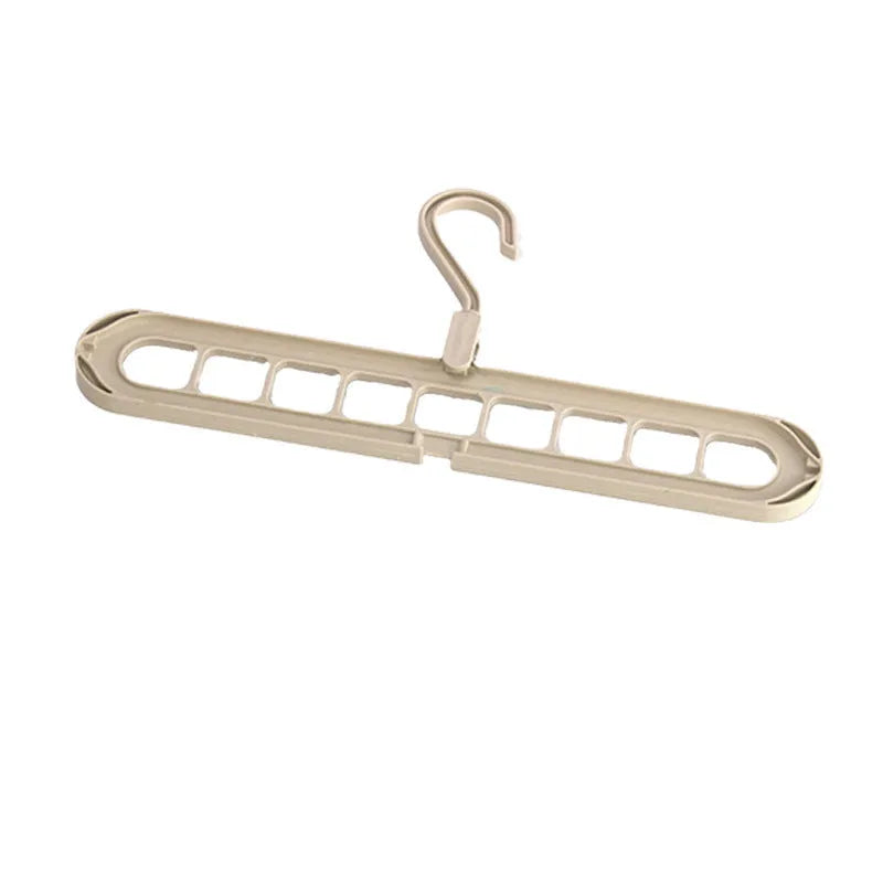 Plastic folding hanger with nine holes for trousers in beige, blue, green, grey, or pink colours.