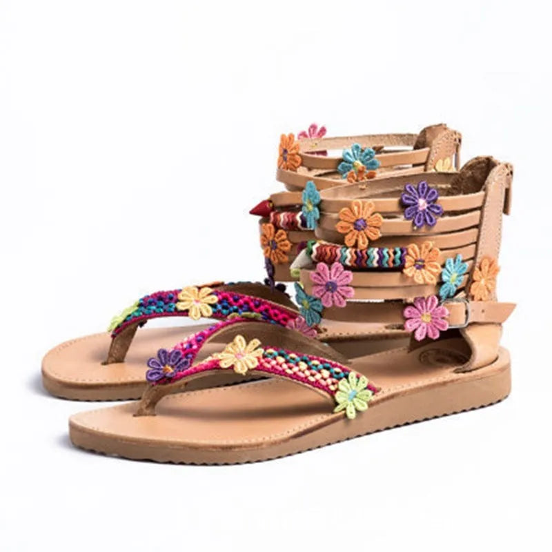 Women's ethnic beaded petal Roman sandals with floral decoration on artificial PU upper.