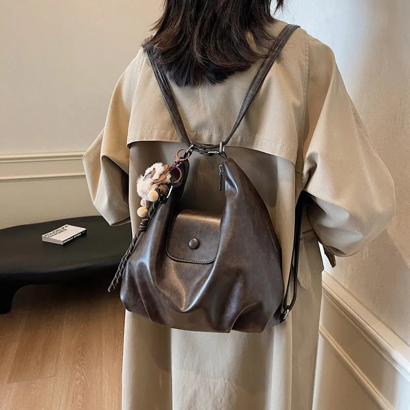 Textured PU leather women's shoulder bag with horizontal square shape and single strap in commuter backpack design