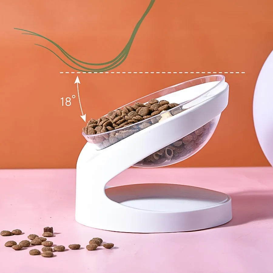 White elevated clear plastic cat food bowl with a tilted feeding surface for neck support.