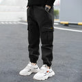 Boys' cotton casual trousers in army green, black, or khaki showing summer overalls style and non-opening crotch design