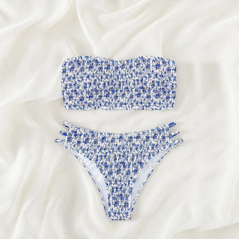 Women's strapless floral swimsuit with high-waist briefs and back split detail.