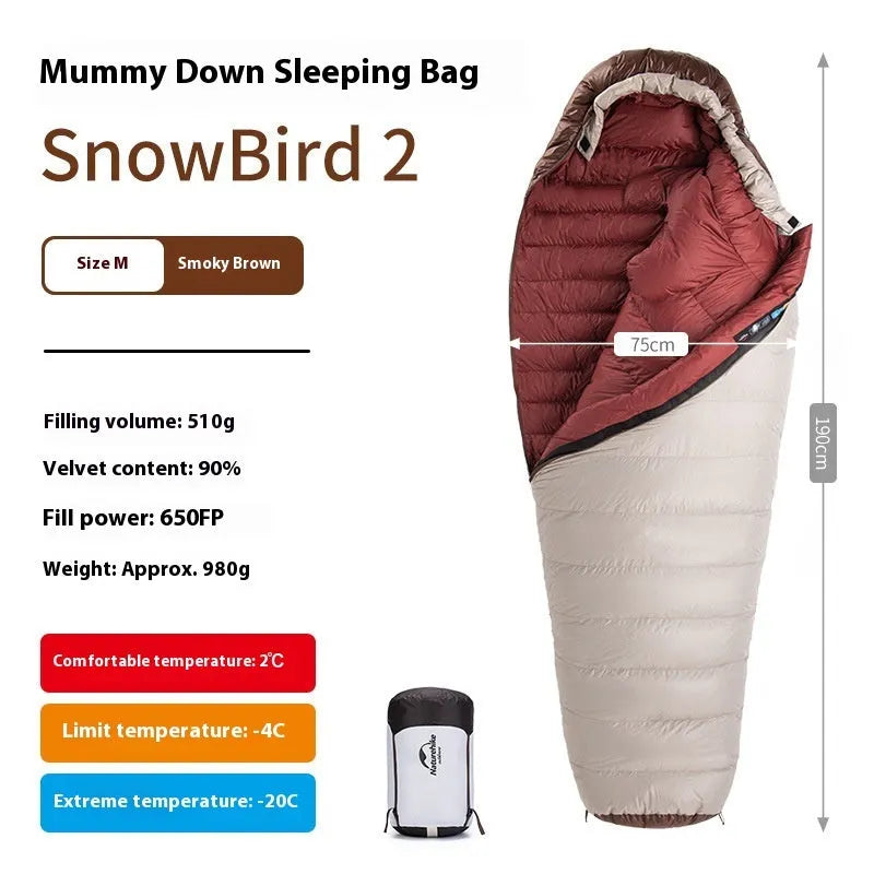 Blue and grey mummy-style down sleeping bag packed in its storage bag for camping.