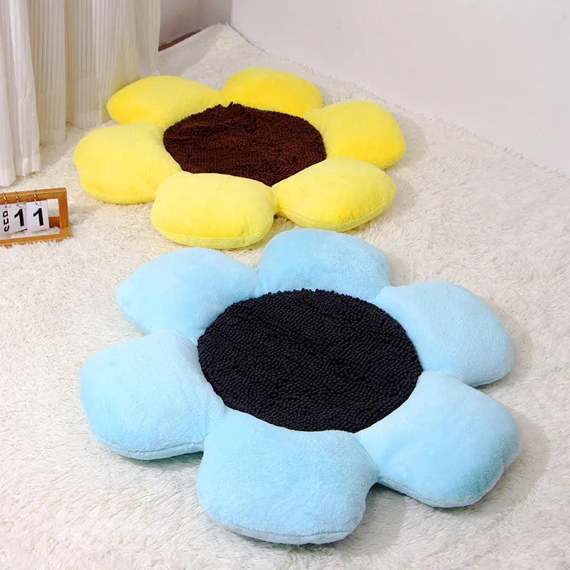 Round blue cat bed with high plush walls and soft filling, shown on a wooden floor.
