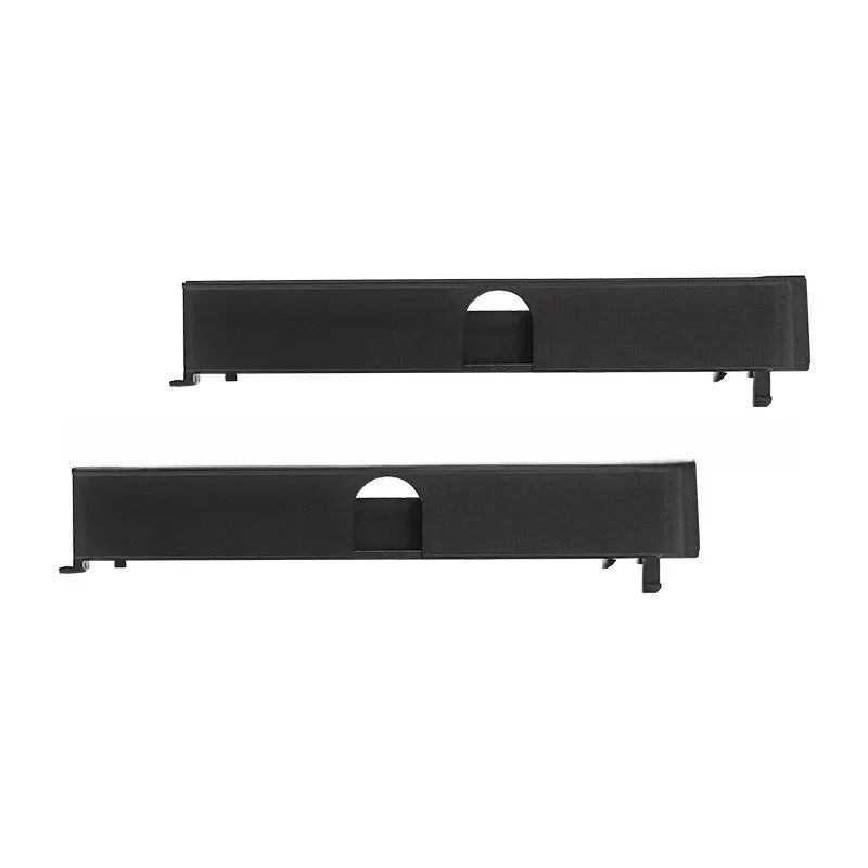 Black PS4 Pro hard drive bottom cover and internal service parts including a baffle and block strip.