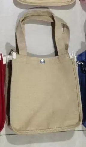 Canvas small square tote bag with magnetic buckle and zipper pocket in black, khaki, red, or white.