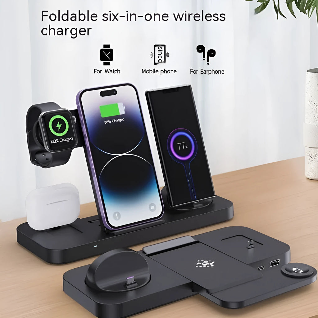 Black six-in-one foldable wireless charger with phone, earbuds, and watch charging zones on a desk