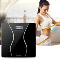 Black electronic digital bathroom scale with a 180kg capacity on a tiled floor.