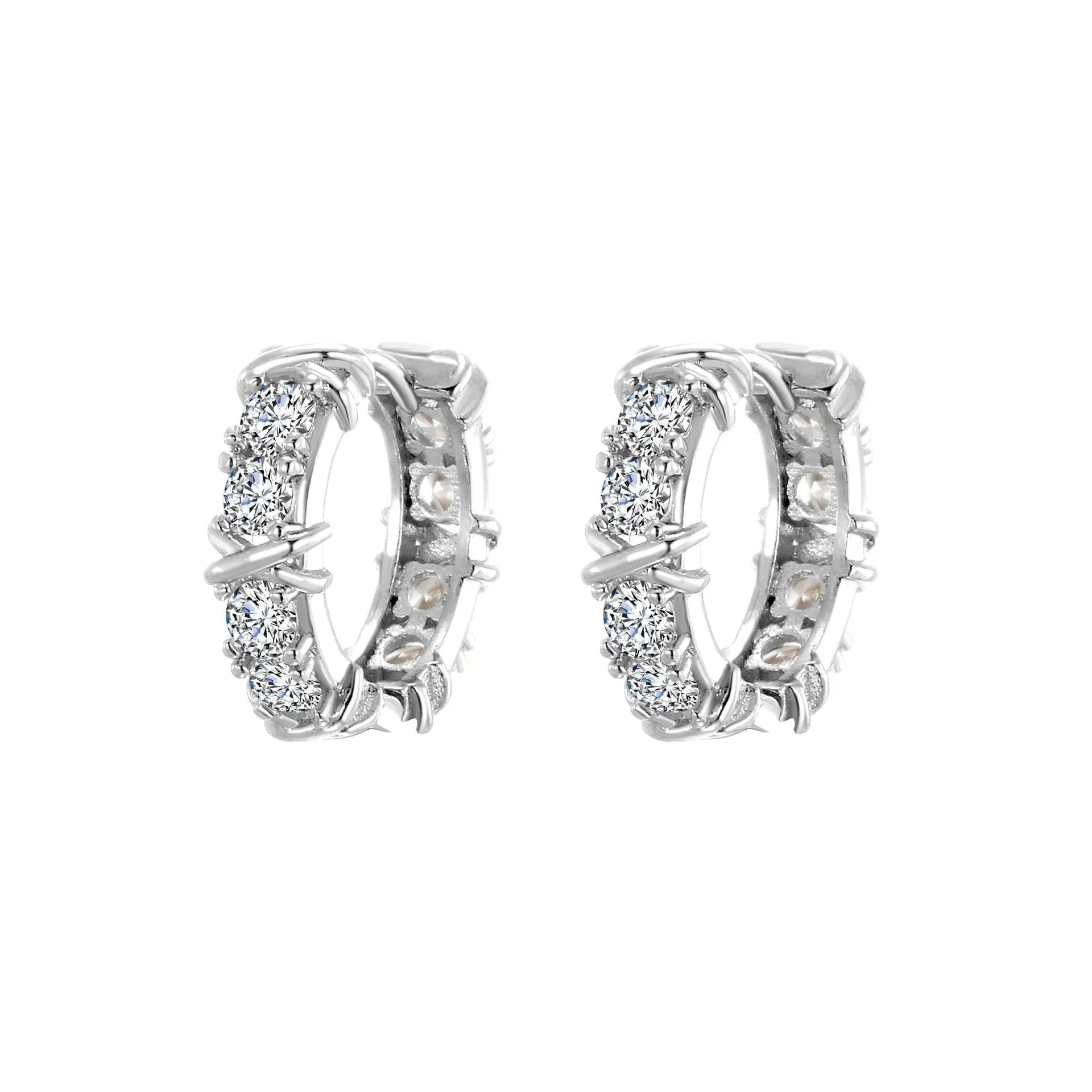 A pair of geometric hexagonal clover cross earrings with an elliptical shape in a gold or silver electroplated finish.