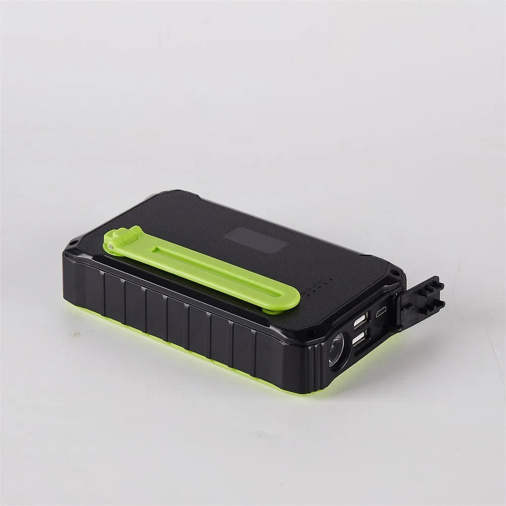 Orange and green hand solar mobile power bank with solar panel and hand crank showing dual USB ports