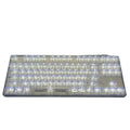 Transparent plastic 132-key mechanical keyboard key cap set displayed on white background