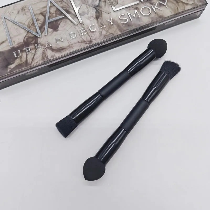 Double-headed miter sponge concealer brush with black artificial fibre bristles on wooden handle